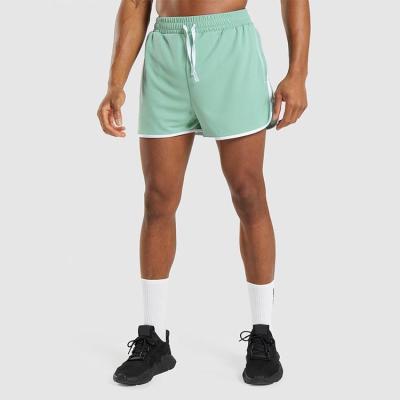 China Custom Sporty Anti-Wrinkle Polyester Shorts Mens Mesh Shorts With Contrast Piping for sale