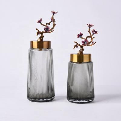 China Handcrafted Modern Home Decor Metal Chinese Style Glass Metal Table Pieces Decoration Conch Storage Gold Jar Tank for sale