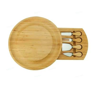 China Sustainable Natural Bamboo Large Round Deli Board Large Bamboo Cheese Board With 4 Knife Set Drawer for sale