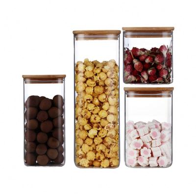 China Borosilicate Wide Mouth Clear Spice Jar Food Stocked Glass Storage Containers With Bamboo Lids for sale