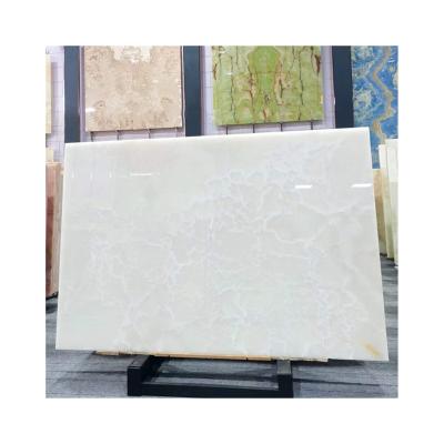 China Modern Exotic Backlit Afghan White Onyx Panel Stone Wall Slab for sale