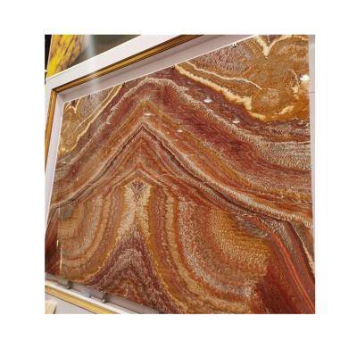 China Modern Translucent Backlit Red Dragon Onyx Marble Wall Panels Slab for sale