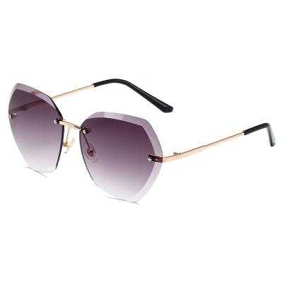 China 2022 Internet Celebrity New Fashion Sunglasses Women's Crystal Trimmed Frameless Metal Wide Frame Polygonal Sunglasses wholesale for sale