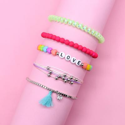 China High Quality Cute Love Letter Color Beads 5-Piece Plastic Spiral Link Children's Bracelet Cord Hair Bracelet for sale