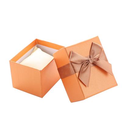 China Recyclable New Ribbon Bow Creative World Cover Watch Box Fashion Gift Box Square Packaging Box for sale