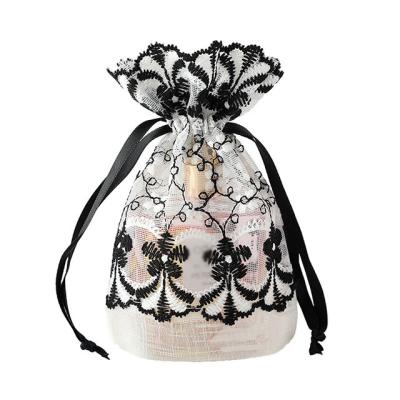 China Gift New Bamboo Yarn Bag Black and White Strange Lace Drawstring Strap Pocket Small Jewelry Mesh Bag Holiday Gift Bag for sale