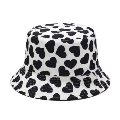 China Cow Print Checked Black White Bucket Hats For Women Men Summer Fisherman Hats for sale