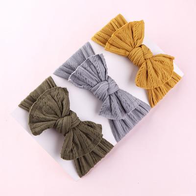 China Hot Selling European and American Style Elastic Jacquard Nylon Baby Rosette Headband for sale