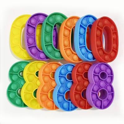 China Educational Toys Silicone Bubble Sensory Bouncy Person Numbers Key Chain For Kids for sale