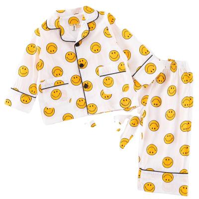 China Thermal Children's kid pajamas set cotton long sleeved suit spring autumn boys' girls' smiley face printed home wear for sale