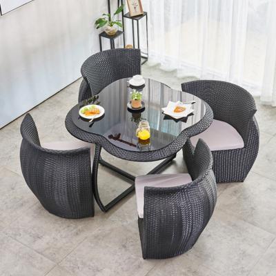 China Modern Unique Outdoor Garden Four Leaf Clover Wicker Patio Set Furniture Rattan Dining Cafe Snack Table And Chairs Sets With 4 Seater for sale