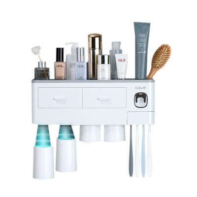 China Hot Selling Amazon Toothpaste Bathroom Storage Stand Holder Viable Universal Toothbrush Holder Punchless Automatic Dispenser for sale