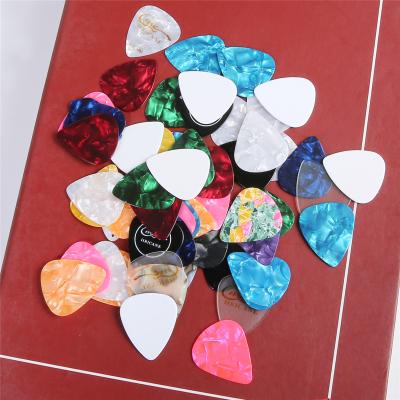 China Offers the cheapest OEM quality one-inch guitar picks includes transparent guitar picks of thin, medium and heavy gauges for sale