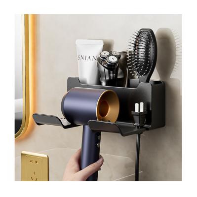 China Sustainable Household Wall-mounted Multifunctional Storage Shelf Plastic Hair Dryer Rack Bathroom Hair Dryer Storage Holder for sale