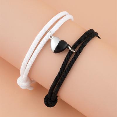 China Durable Most Popular Woman Black And White Heart Shaped Magnetic Buckle Woven Couples Bracelet for sale