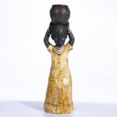 China Africa Abigail Factory Tribal Retro Culture Gold Wood Children's Table Ornaments Ornaments Resin Crafts for sale