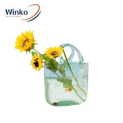 China Nordic Home Decoration Clear Bubble Flower Handbag Glass Vase Art Deco Creative Basket Hydroponic Flower Vases for sale