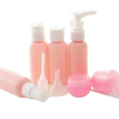 China Pink Small Mini Pump Personal Care Products Lotion Bottle 30ml Travel Cosmetic Bottles Set PET Material for sale