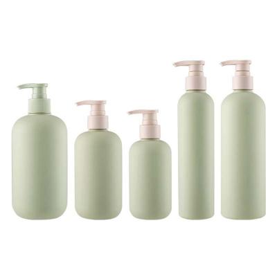 China Personal Care Products Round Shoulder Shape Travel Plastic Shampoo Bottles With Pump 200ml 300ml 500ml for sale