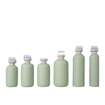 China Personal Care Products PE Material Cylindrical Green Shampoo Bottle Plastic Lotion 200ml 500ml Travel Set Bottles for sale