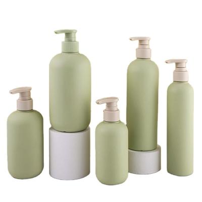 China Personal Care Products Round Shoulder Shape Travel Plastic Shampoo Bottles With Pump 200ml 300ml 500ml for sale