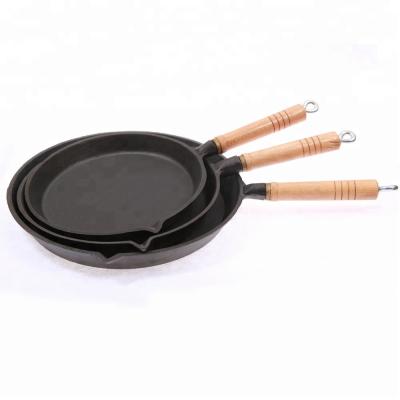 China Sustainable Round Cast Iron Steak Pan With Handles High Quality Smooth Cast Pancake Pans With Wooden Handle for sale