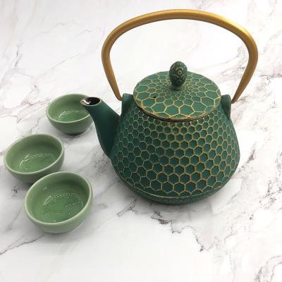 China Durable Colorful Coated Cast Iron Teapot Kettle Pot With Stainless Steel Infuser for sale