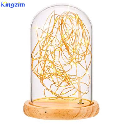 China Romantic Battery Operated LED Candle Glow Dome Lamp Glass Bell String Fairy Light with Wood Base for sale