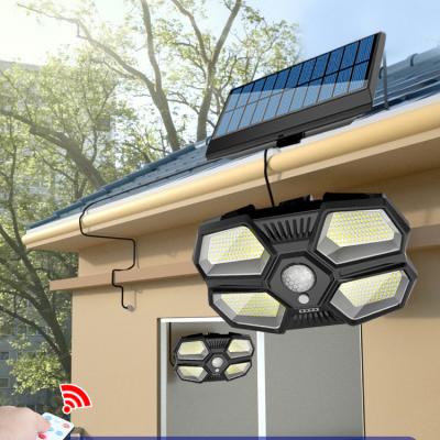 China Motion Sensor Solar Powered Outdoor Garden Lamp Polycarbonate 180 LED Solar Powered Split Wall Light For Garage Yard Patio Porch for sale