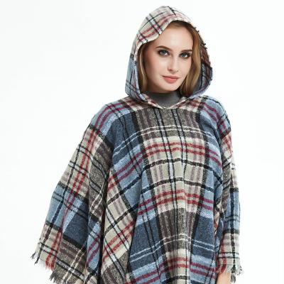 China 2021 China factory polyester thicken tassel winter women and men warm cape shawls with hat 135*135 for sale