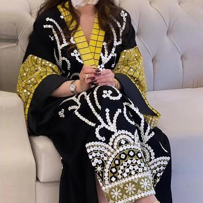 China Anti-Static Elegant Muslim Ladies Printed V-Neck Long Swing Sleeves Loose Middle East Dresses For Women for sale