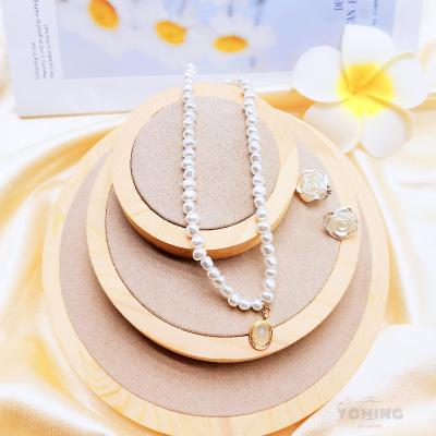 China Shop Display Home Decoration Customized Design Round Jewelry Display Tray Ring Bracelet Pendant Earring Standing Solid Wood Jewelry Display Set 3 for sale