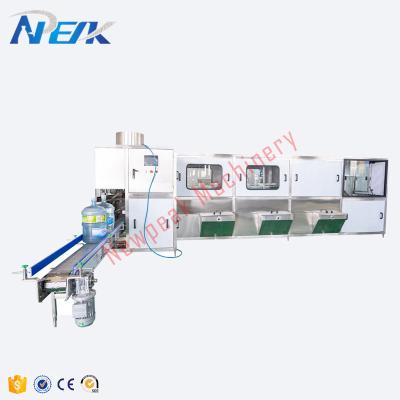 China low cost newpeak high efficiency 5 gallon bucket water washing/filling machine for spring mineral water liquid filling machine for sale