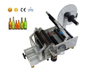 China Máquina de etiquetado semi automática de la mano del frasco de los cosméticos, equipo de etiquetado de la botella de leche en venta