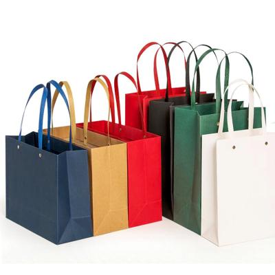 China Recyclable Creative Design Printing Custom Logo Shopping Paper Bag With Rivet Rope for sale