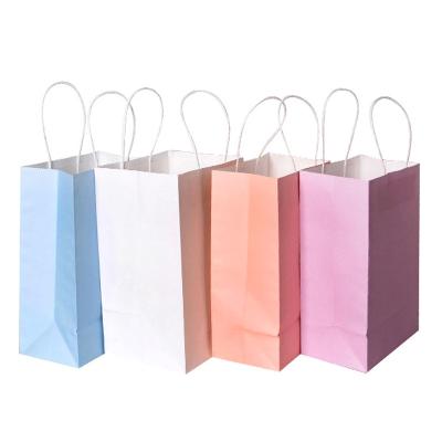 China Recyclable Wholesale Cheap Price Kraft Paper Shopping Gift Bag For Packaging Christmas Birthday Gift for sale