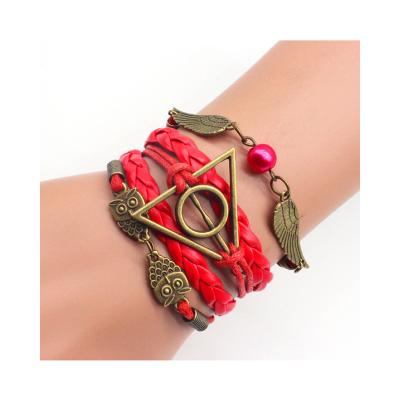 China FASHIONABLE Top Popular Vintage Movie Rope Handwoven Deathskin Leather Rope Hallows Triangle Owl Wing Wax Rope Bracelet for sale