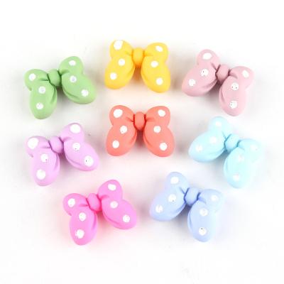 China Europe hot sale colorful flatback bowknot shape resin craft for kids hair ornament for sale