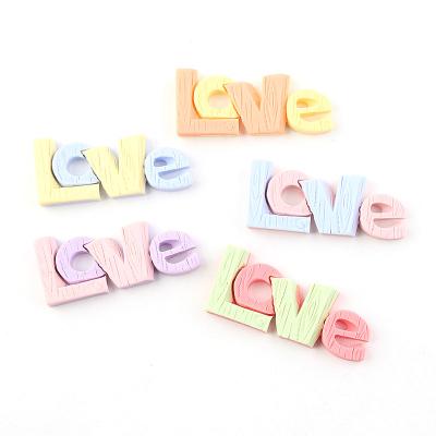 China Hot Sale Europe Two Tone Colored Design Resin Flat Cabochons Of Love Word Texts For Mobile Case for sale