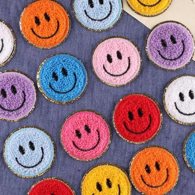 China Iron On Patches Highest Quality Gold Round Glitter Embroidered Chenille Smile Face Sweater Patches For Towel Decoration for sale