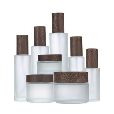 China Cosmetic Frosted dark wood grain lid cosmetics empty bottle lotion bottle sealed cream jar for sale