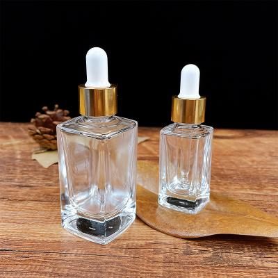 China Cear Square Personal Care Rectangle Glass Essential Oil Glass Dropper Bottles Pipette Bottles15ml 30ml With Gold Pipette Cap for sale