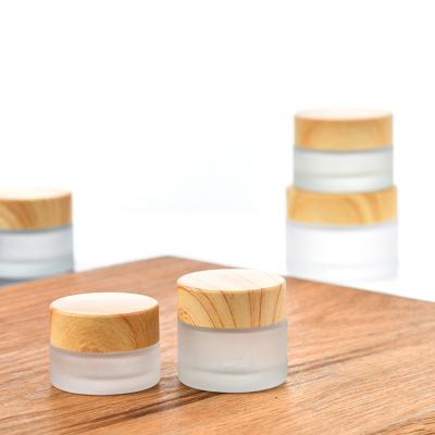 China Wholesale Personal Care Scrub Cream Glass Bottle With Wood Grain Cap for sale