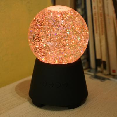 China 2018 New Arrival Mini Design Led Blue Color Ball Tooth Speaker With Glitter Water Globe for sale