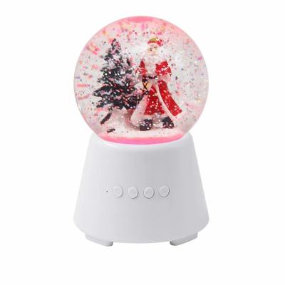 China Mini Plastic Electric Music Christmas Wireless Portable Snow Globe Speaker Acrylic Snow Blowing Ball for sale