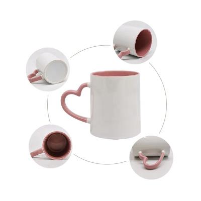 China Viable Wholesale Ceramic Mugs 11oz Heart Handle Sublimation Ceramic Mug Coffee Mug for sale