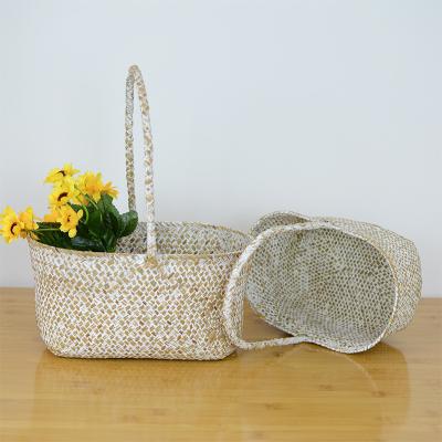 China Rustic New Arrivals Natural Seaweed White Washed Oval Home Woven Willow Flower Potted Storage Baskets Set Of 2 for sale