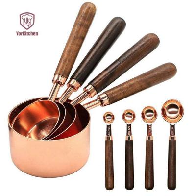 China Sustainable 8 Pcs Baking Rose Gold Copper Measuring Cups Set Walnut Wooden Handle Measuring Cup Set for sale