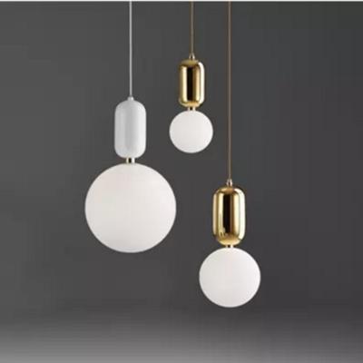 China Modern Living Room Bedroom Study Restaurant Metal Frosted Glass Pendant Light for sale