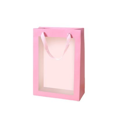 China Recyclable Pink Paper Bag With Window Printing Logo Custom Paper Bag For Christmas Gift for sale